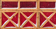 wooden wall in German or Scandinavian style covered snow in winter - the yellow wooden planks is on red wood background, new and clean surface