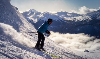 Wall Mural - Adventurous Girl Skiing on a beautiful snowy mountain during a vibrant and sunny winter day. Taken in Whistler, British Columbia, Canada.