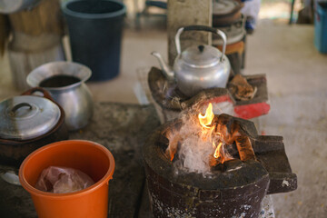 Thai traditional cooking by fire hot charcoal clay stove