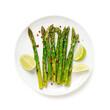 Grilled organic asparagus with lemon on white plate .isolated on white background.top view