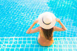 © siraphol - Portrait beautiful young asian woman relax smile leisure around outdoor swimming pool