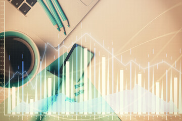 Double exposure of forex graph drawing over desktop background with computer. Concept of financial analysis. Top view.