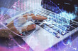 © peshkova - Double exposure of woman hands typing on computer and business theme hologram drawing. Success concept.