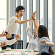 © Bangkok Click Studio - Group of five diverse businessmen, two men and three women at meeting desk. The woman feels excited and the team congrats. and cheer her up.
