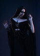 © FlexDreams - Young woman in black dress in Gothic style