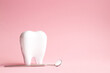 White tooth with dental mirror on pink background in honor of international dentist day with place for text