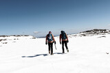 Fototapeta Na sufit - Couple walking in the snow