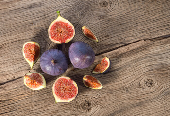 Wall Mural - Fig fruits on wooden background top view