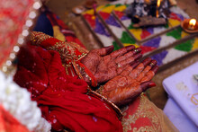 Bride Hands With Red Henna Pattern Or Design In Indian Wedding Or Hindu Tradition