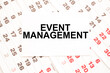 © Valeria - text EVENT MANAGEMENT on a sheet from Notepad.a digital background. business concept . business and Finance.