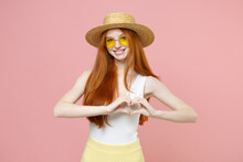 Young Kid Lovely Happy Good Redhead Woman 20s Ginger Long Hair Wear Straw Hat Glasses Summer Clothes Show Shape Heart With Hands, Heart-shape Sign Isolated On Pastel Pink Background Studio Portrait