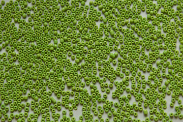 Green beads background, close up