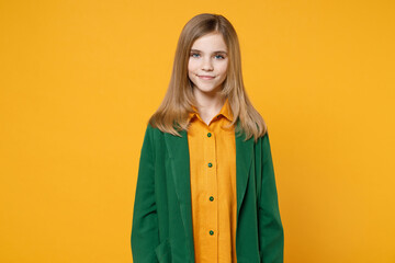 Wall Mural - Little blonde pretty cute kid girl 12-13 years old wearing casual clothes green shirt looking camera smiling isolated on yellow orange background children studio portrait. Childhood lifestyle concept