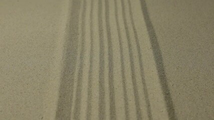 Wall Mural - Zoom, straight lines made of sand on the beach. Abstract texture.