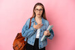 © luismolinero - Young caucasian student woman isolated on pink background surprised and shocked while looking right