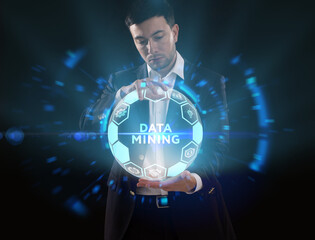 Business, Technology, Internet and network concept. Young businessman working on a virtual screen of the future and sees the inscription: Data mining