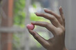 © Zero - person holding a heart shape candy