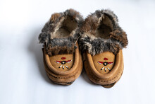 A Pair Of Indigenous-made, Beaded Rabbit Fur Moccasin Slippers In Southwestern Ontario, Canada.