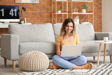 Sticker - Young woman with laptop at home