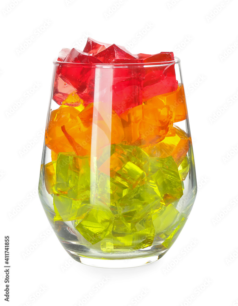 Glass with tasty jelly cubes on white background