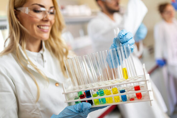 Wall Mural - Woman student, scientist of chemistry working in laboratory