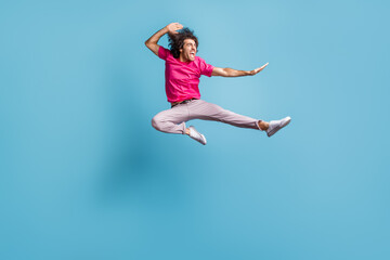 Wall Mural - Full length body size view of attractive cheerful crazy motivated guy jumping dancing ballet isolated over bright blue color background