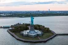 Aerial Of The Statue Of Liberty At Sunset, New York, USA