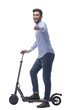 © ASDF - side view. attractive young man with an electric scooter.