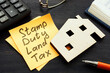 © Vitalii Vodolazskyi - Stamp duty land tax SDLT memo and model of home.
