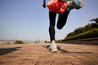 © imtmphoto - young asian woman running outdoors in city park