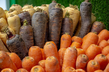 Background:mix of orange ,purple and white carrots