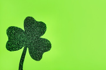 Decorative clover leaf on light green background, space for text. Saint Patrick's Day celebration