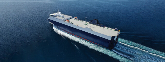 Aerial drone ultra wide photo of large RoRo (Roll on-off) vessel cruising the Atlantic Ocean deep blue sea