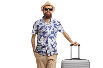 Male tourist posing with a suitcase