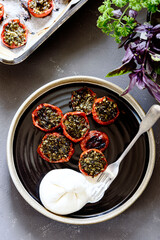 Wall Mural - Provencal Tomatoes. Baked Tomatoes with parsley, garlic and olive oil served with burrata cheese