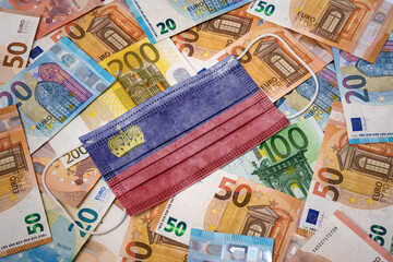 Medical mask with the flag of Lichtenstein on a variety of european banknotes.(series)