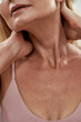 © Svitlana - Decollete of middle aged woman with raised hands