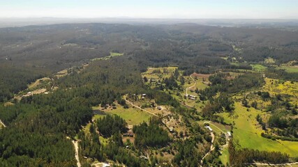 Wall Mural - amazing aerial view of the chilean countryside with the trees in the forest and agricultural fields 