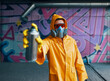 © GVS - Graffiti artist pointing spray paint can to camera