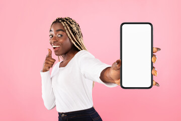 Black woman showing blank smartphone screen for mockup