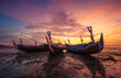 © RooM The Agency - Three traditional boats on beach at sunset, Tuban, Bali, Indonesia