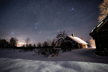 Wall Mural - Milky way with stars in clear summer night. Old barn house. Country side.