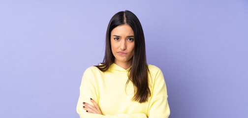 Wall Mural - Young caucasian woman over isolated background with unhappy expression