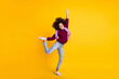 Full length photo of funny dark skin person have fun playing wear sweater isolated on yellow color background