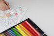 © Olesia Prokoshina - Drawing mandala anti stress with multicoloured pencils during lockdown.