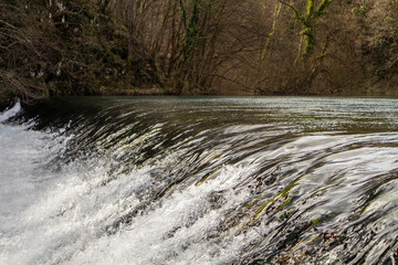 Canvas Print - Crystal clear mountain river Slunjcica, falling over cascade, deep in the mountain forest near Rastoke village, Croatia