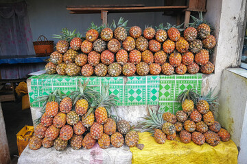 Poster - Pile of fresh pineapples on display at street market in Madagascar