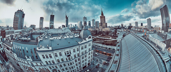 Wall Mural - Beautiful panoramic aerial drone view on Warsaw City Skyscrapers, PKiN, and Varso Tower under construction and 19th-century tenement houses during the sunset, Warsaw, Poland.