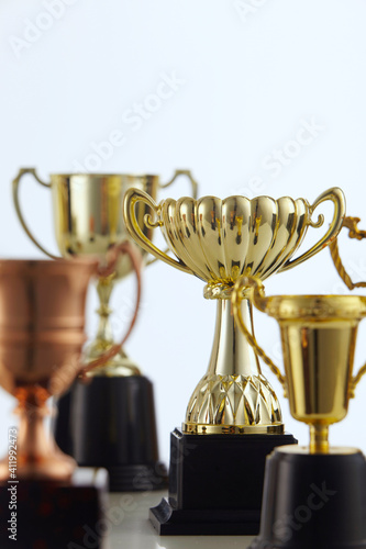 Close-up Of Trophies Against White Background