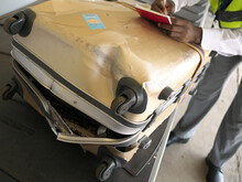 Livingstone,Zambia-August 5, 2016: A Completely Broken Suitcase Due To Poor Handling At An Airport
